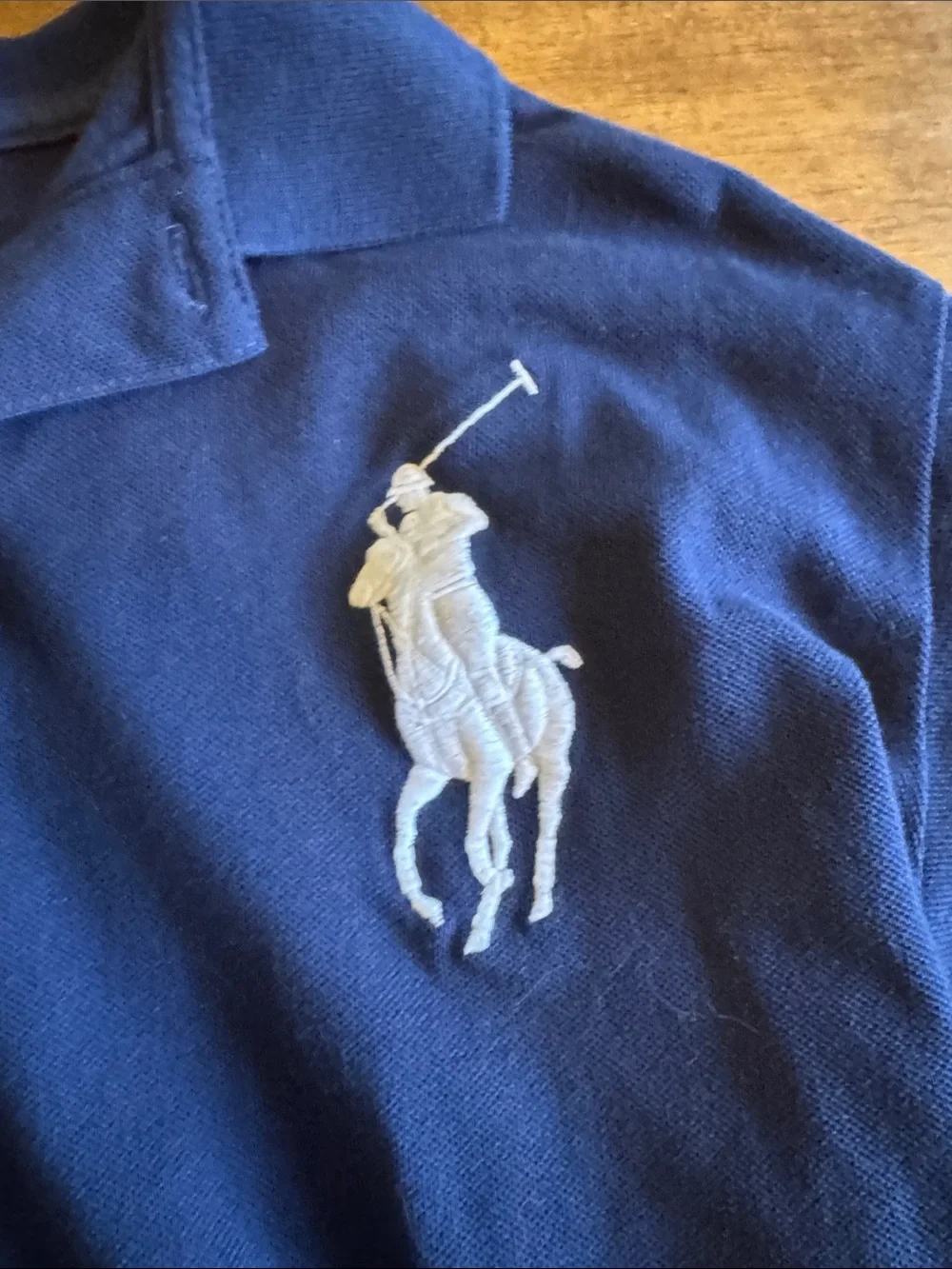 Ralph Lauren Navy Blue Polo Shirt with White Pony Logo.